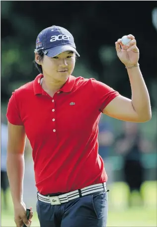  ?? MARK VAN MANEN/ PNG STAFF ?? Yani Tseng celebrates her birdie putt on the ninth hole at the Vancouver Golf Club during the CN Canadian Women’s Open in Coquitlam on Thursday. She went on to birdie five of the last six holes.