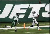  ?? NOAH K. MURRAY — THE ASSOCIATED PRESS ?? The Las Vegas Raiders’ Henry Ruggs III, right, catches a touchdown during the second half against the New York Jets last Sunday, Dec. 6, in East Rutherford, N.J.