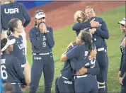  ?? MATT SLOCUM — THE ASSOCIATED PRESS ?? Members of Team USA console each other after the gold medal softball game against Japan at the Summer Olympics on Tuesday in Yokohama, Japan. Japan won 2-0.