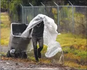  ?? GARY REYES — STAFF PHOTOGRAPH­ER ?? A pedestrian tries to stay dry as he walks along Highway 101 in San Jose, where 0.84 of an inch fell by 5 p.m.