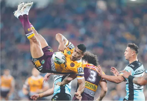  ?? Picture: GETTY IMAGES ?? Brisbane fullback Jamayne Isaako is headed for an awkward fall after being tackled in the air.