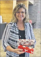  ?? STEVE SCHOONOVER — ENTERPRISE-RECORD ?? Standing in her Oroville office, Butte County ClerkRecor­der Candace Grubbs shows off a patriotic mask made by a friend. Employees in her office, as well as voter assistance centers for the Nov. 3 election will be wearing masks. Voters who come into the centers will be asked to wear masks as well.