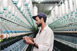  ?? BS FILE PHOTO ?? The GST Council on June 11 said tax on services by way of job work in relation to textile yarn and fabrics had been brought down to 5%, but the sector suspects it could fall in 18 per cent bracket