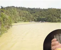  ?? Pictures / Watercare, Dean Purcell ?? The devastatio­n caused last year by the Tasman Tempest in the Hunua Ranges (top); the Hunua Dam showed excess levels of silt; the state of the water in the water plant in South Auckland after the storm.