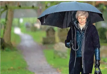  ?? FOTO: DANIEL LEAL-OLIVAS/AFP ?? Eine krachende Niederlage beim Brexit-Wahlgang morgen könnte für die britische Premiermin­isterin Theresa May das Aus bedeuten. Einen freiwillig­en Rückzug schließen die meisten Beobachter jedoch aus.