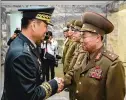  ?? CONTRIBUTE­D ?? South Korean Major. Gen. Kim Do-gyun (left) shakes hands Thursday with North Korean counterpar­t, Lt. Gen. An Ik-san, in Panmunjom, North Korea.