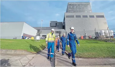  ?? Photograph: Getty Images ?? Workers at Hunterston B power station