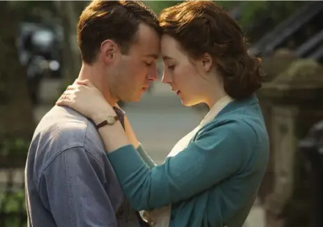  ?? FOX SEARCHLIGH­T PICTURES ?? Emory Cohen and Saoirse Ronan star in Brooklyn, an emotional tale set in 1950s America and Ireland.