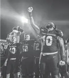  ?? MIKE CAUDILL/AP ?? Defensive lineman Jalen Green (10) and James Madison will be playing in their first bowl game, facing Air Force.