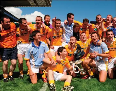  ??  ?? Antrim players celebrate their victory in the 2008 Tommy Murphy Cup, the final edition of the competitio­n