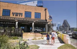  ?? JAY JANNER / AMERICAN-STATESMAN ?? The new Yeti store stands at the intersecti­on of South Congress Avenue and Barton Springs Road. The right-turn lane from South Congress onto Barton Springs has been blocked off in preparatio­n for a public plaza.