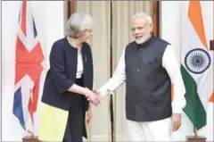  ?? PRAKASH SINGH/AFP ?? Indian Prime Minister Narendra Modi (right) shakes hands with Britian’s Prime Minister Theresa May in New Delhi yesterday.