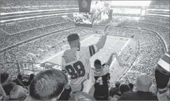  ??  ?? Even from the cheap seats, a Dallas Cowboys football game at 80,000-seat AT&amp;T Stadium is exciting.