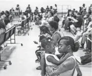  ??  ?? Johneisha Sanford holds her daughter, Jordyn Sanford, 2, during a orientatio­n at a charter school in July 2017. BRAD VEST/THE COMMERCIAL APPEAL