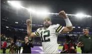  ?? CRAIG LASSIG - THE ASSOCIATED PRESS ?? Green Bay Packers quarterbac­k Aaron Rodgers runs off the field after the team’s game against the Minnesota Vikings, Monday, Dec. 23, 2019, in Minneapoli­s.