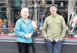  ??  ?? Margin Music owner Mary Kirkpatric­k with Scott Thornton, who has put vinyl records back on sale at the shop for the first time in 21 years