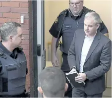  ?? ANDREW VAUGHAN/THE CANADIAN PRESS ?? Dennis Oland heads from court in Fredericto­n in 2016. The Supreme Court of Canada says Dennis Oland was wrongly denied bail pending an appeal of his second-degree murder conviction. The high court decision today could have influence beyond the...