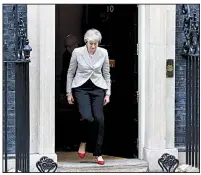  ?? AP/KIRSTY WIGGLESWOR­TH ?? Prime Minister Theresa May exits her office at No. 10 Downing St. in London. She said Thursday that Britons want the European Union exit matter settled.