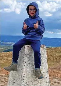  ?? ?? ●●Thomas Roderick finished his challenge with a walk up Pendle Hill