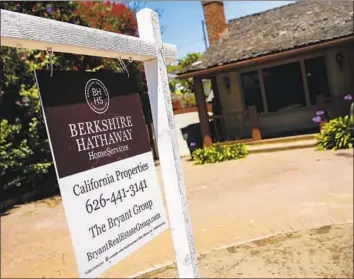  ?? Jay L. Clendenin Los Angeles Times ?? THE SHARP increase in mortgage rates stems from the same rise in the overall cost of borrowing that sent stocks tumbling Wednesday and Thursday. Above, a home for sale in Redondo Beach in 2014.