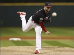  ?? ELSA GARRISON — THE ASSOCIATED PRESS ?? Cleveland Indians starting pitcher Corey Kluber throws during the first inning of Game 1of the Major League Baseball World Series against the Chicago Cubs Tuesday in Cleveland.