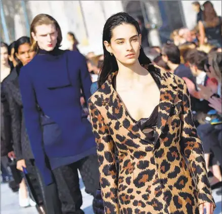  ?? Andreas Solaro / AFP ?? LOOKS from Bottega Veneta’s fall 2019 collection, the first by new creative director Daniel Lee, at Milan Fashion Week in February.