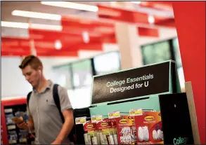  ?? Star Tribune/GLEN STUBBE ?? A display of merchandis­e for college students stands in a Target Express store in the Minneapoli­s commercial district called Dinkytown. Target is expanding the Express store concept to college towns across the United States.