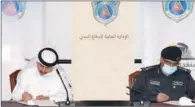  ??  ?? Director General of Civil Defence Brigadier Hamad Othman Al Duhaimi and QRCS Secretary-General Ali bin Hassan Al Hammadi sign an agreement on Monday.