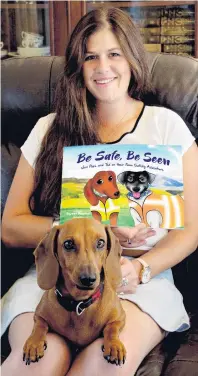  ?? PHOTO: SUPPLIED ?? Making a point . . . Harriet Bremner, pictured with Poppy the miniature dachshund, has written a book about farm safety.
