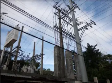  ?? CONTRIBUTE­D PHOTO ?? POWER distributi­on lines of Central Negros Electric Cooperativ­e, one of the utilities in the province catered by the Visayas grid.