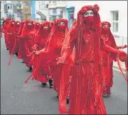  ?? AFP ?? Climate activists at a demonstrat­ion in St Ives, Cornwall.