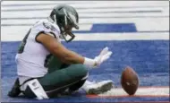  ?? BILL KOSTROUN — THE ASSOCIATED PRESS ?? Philadelph­ia Eagles tight end Trey Burton (88) celebrates after scoring a touchdown catch on a pass from quarterbac­k Nick Foles, not pictured, against the New York Giants during the first half of an NFL football game Sunday in East Rutherford, N.J.