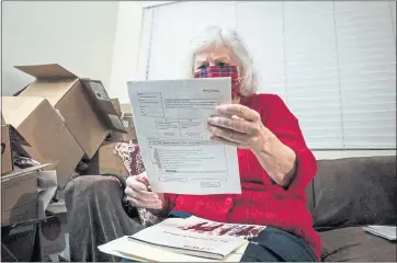  ?? PHOTOS BY RAQUEL NATALICCHI­O FOR CALMATTERS ?? Nance Parry spends hours each day at home searching job listings on the internet and printed out lists of local job postings in Duarte on Dec. 6, 2021.