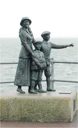  ?? RICK STEVES ?? Outside Ireland’s Cobh Heritage Center is a statue of Annie Moore and her two brothers. Moore was the first immigrant to be processed at Ellis Island, N. Y.