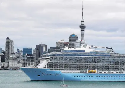  ?? PHOTO: GETTY IMAGES ?? Too big . . . Unable to berth at Auckland wharves, Ovation of the Seas anchors in Waitemata Harbour.