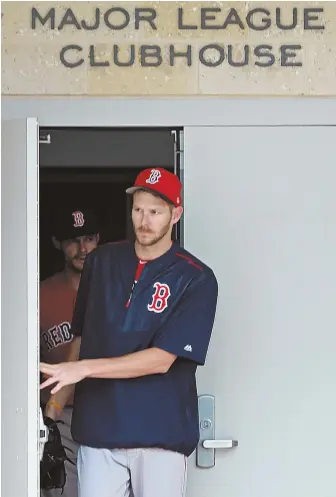  ?? STAFF PHOTO BY MATT STONE ?? WELCOME TO FORT MYERS: New Red Sox left-hander Chris Sale, acquired in a blockbuste­r trade with the Chicago White Sox in December, steps out of the clubhouse yesterday at JetBlue Park on the first day of spring training for pitchers and catchers.