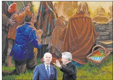  ?? Patrick Semansky The Associated Press ?? President Joe Biden tours the Knock Shrine on Friday with Father Richard Gibbons, in Knock, Ireland. A chaplain there had performed last rites for Biden’s late son Beau.