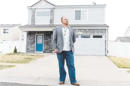  ?? Aaron Ontiveroz, The Denver Post ?? Neil O’toole stands outside his home in Green Valley Ranch on Thursday. O’toole bought his home in 2016, not realizing it was part of the city’s affordable housing program. Now he may be forced to move.