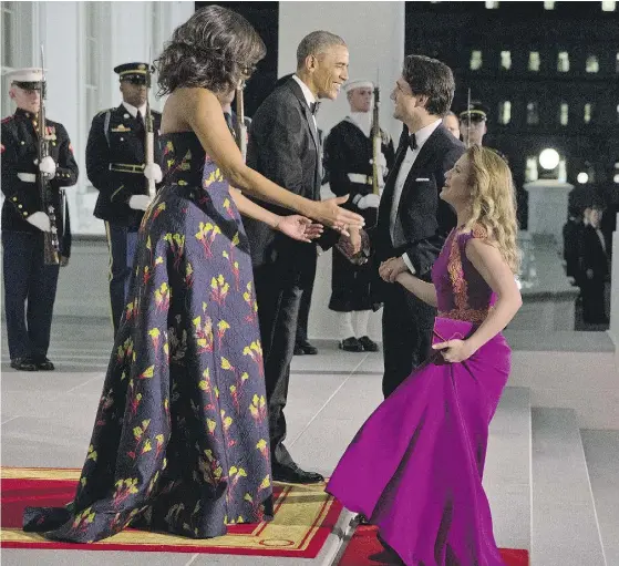 ?? JACQUELYN MARTIN / THE ASSOCIATED PRESS ?? President Barack Obama and Michelle Obama greet Prime Minister Justin Trudeau and Sophie Grégoire-Trudeau for a state dinner.