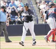  ?? Lynne Sladky / Associated Press ?? New York Yankees pinch hitter Russell Wilson, also a Seattle Seahawks quarterbac­k, center, walks off after striking out during the fifth inning of a spring exhibition game against Atlanta on Friday.