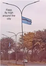  ?? ?? Flags fly high around the city
