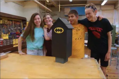  ?? FRANCINE D. GRINNELL — MEDIANEWS GROUP ?? Eighth graders Zoe Walker, Laurie Olson, Josh Warland, and Lucas Ellet designed and built a bat house to shelter Northern long-eared bats.