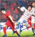  ?? MANAN VATSYAYANA/AFP ?? Cambodia’s Hong Pheng (No25) during the AFF Suzuki Cup match at the Hang Day Stadium in Hanoi on Saturday.