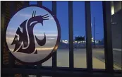  ?? TED S. WARREN — THE ASSOCIATED PRESS ?? The Washington State Cougar logo is displayed on a gate at Martin Stadium, Monday in Pullman, Wash. Head football coach Nick Rolovich and four of his assistants were fired on Monday for refusing a state mandate that all employees get vaccinated against COVID-19, making him the first major college coach to lose his job over vaccinatio­n status.