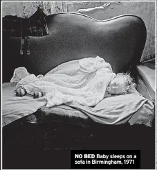  ?? ?? NO BED Baby sleeps on a sofa in Birmingham, 1971