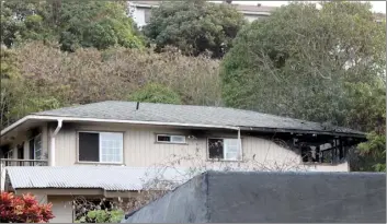  ??  ?? A burned out window is shown on a home on Holowai Place after the Fire Department extinguish­ed the flames around 4:30 p.m. Wednesday in Wailuku.