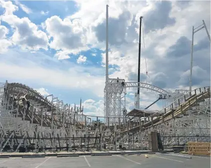  ?? DEWAYNE BEVIL/STAFF ?? Constructi­on of the Mine Blower roller coaster continues at the Fun Spot attraction in Kissimmee. It will include a 115-degree overbanked turn.