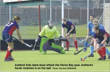  ?? Picture: Paul Amos FM4044006 ?? Ashford 3rds (dark blue) attack the Herne Bay goal. Ashford’s Sarah Andrews is on the ball