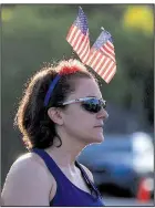  ?? Arkansas Democrat-Gazette/STATON BREIDENTHA­L ?? Sarah Higgins of Little Rock awaits the start of the Firecracke­r Fast 5K on Wednesday morning.