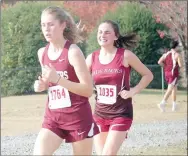  ?? Graham Thomas/Herald-Leader ?? Siloam Springs freshman Sydney Moorman, left, finished 24th overall with a time of 22:15.3 on Friday at the Class 6A state cross country meet at Oaklawn Park in Hot Springs.